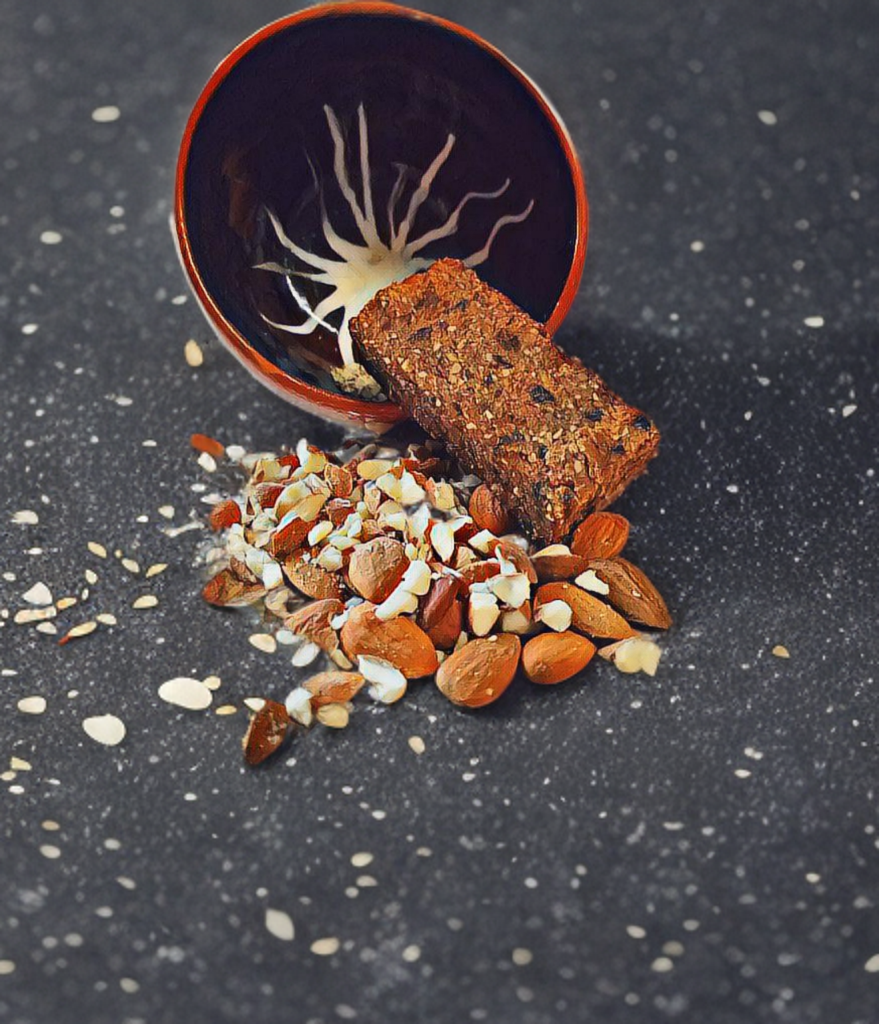 Barre Osmose posée sur des amandes concassées